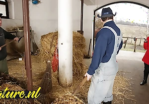 Hairy horse tamer double permeated in horse stable for their way first time