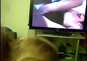 Mom gives daughter head while he watches porn