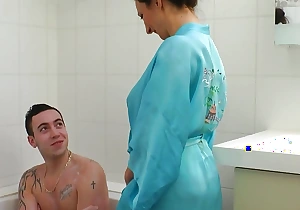 Mature Caroline wants anal intercourse in the bathroom with her stepson